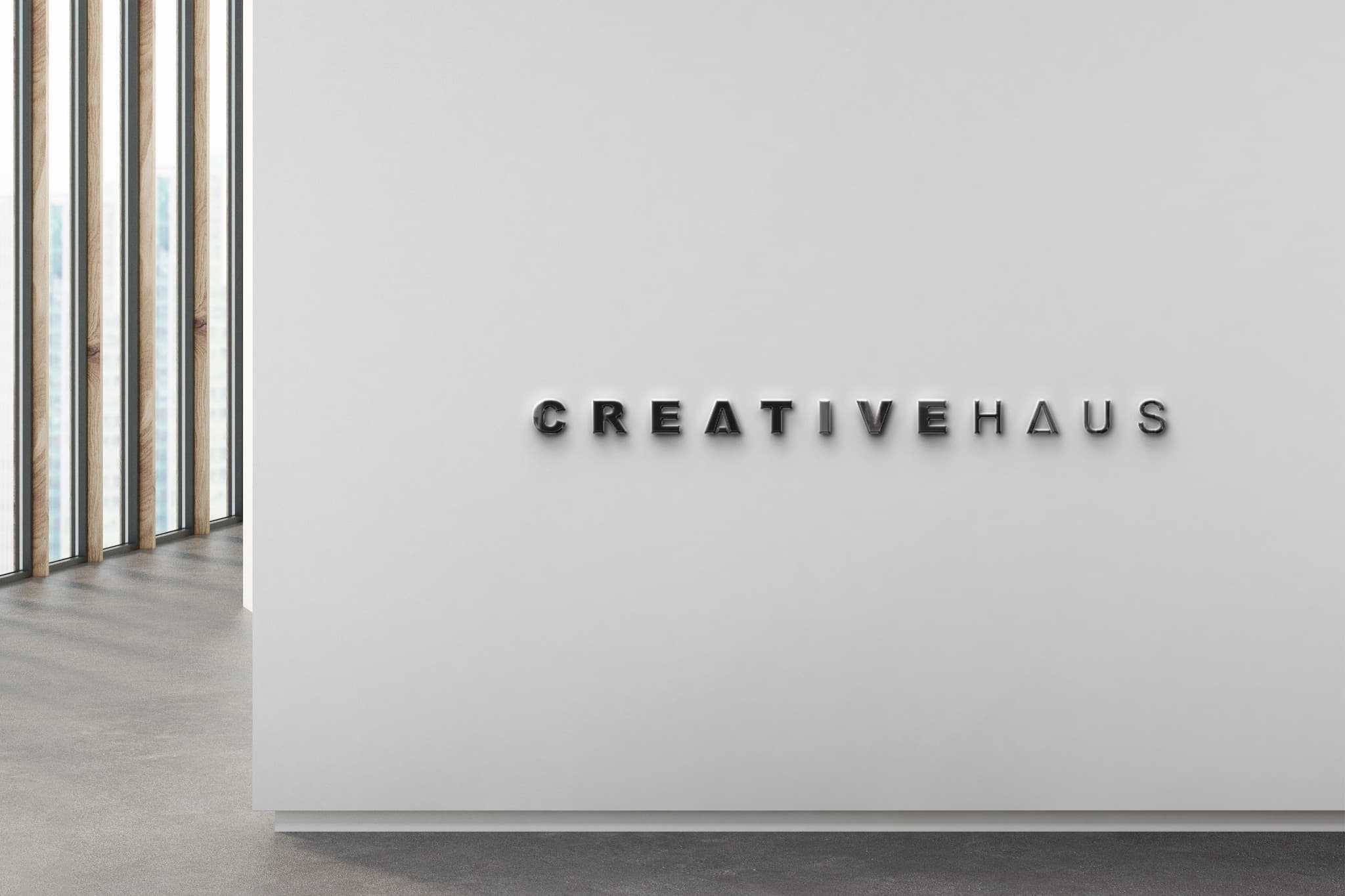 CREATIVEHAUS dimensional lettering on a bright reception wall.