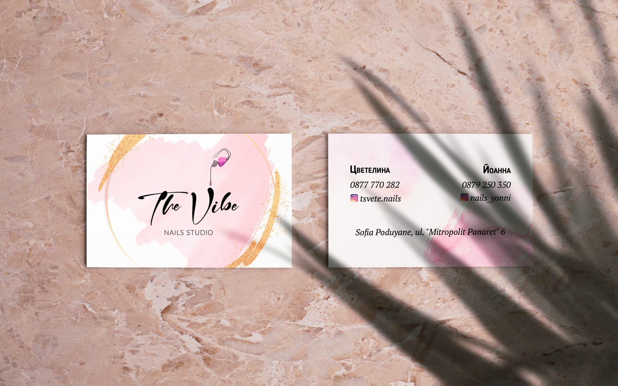 Front and back of THE VIBE business cards with the studio contact details.