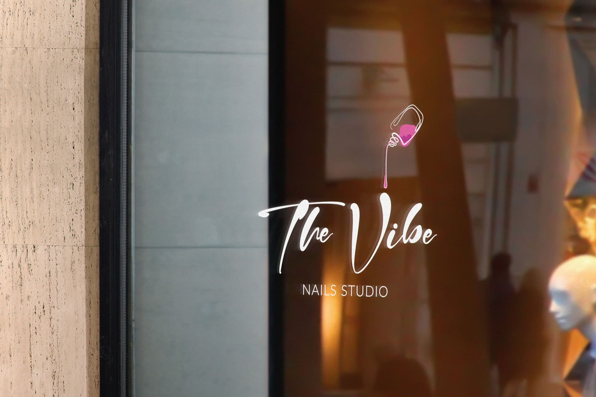 THE VIBE Nails Studio logo applied to the studio's glass entrance.